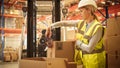 Female Warehouse Inventory Manager Finishes Packing Cardboard Box Closing it and Sealing with Tape Royalty Free Stock Photo