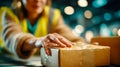 Female warehouse worker sealing cardboard box with tape during logistics and packaging process in distribution center Royalty Free Stock Photo