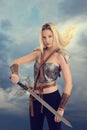 Female warrior with sword and hair blowing in wind Royalty Free Stock Photo