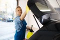 Female washer wipes wax spray, car wash service