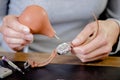 Female watch repair expert