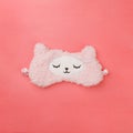 Female wearing cute kawaii sleeping band pink lama, trendy soft pastel pink and coral colours on empty background. Top view Soft