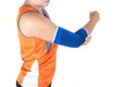 Women wearing orange exercise tops and blue elbow support cloths. Royalty Free Stock Photo