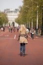 Female wearing rollerblades skates along The Mall