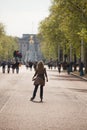 Female wearing rollerblades skates along The Mall