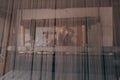 Female Weaver behind an Authentic Fabric Weaving Machine