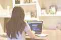 Female web developer writing code on laptop in co-working space as remote work. Royalty Free Stock Photo
