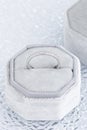 Female wedding diamonds ring in white jewelry box