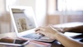 Female white hands on an aluminum laptop keyboard typing texting Royalty Free Stock Photo