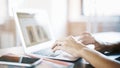 Female white hands on an aluminum laptop keyboard typing texting Royalty Free Stock Photo