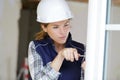 female window fitter making adjustment Royalty Free Stock Photo