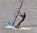 Female windsurfer surfboarding