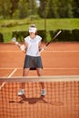 Female winner at tennis court Royalty Free Stock Photo