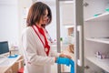 Female woman  Doctor  nurse  holding a syringe while standing in a medical office Royalty Free Stock Photo