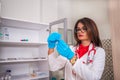 Female woman  Doctor  nurse  holding a syringe while standing in a medical office Royalty Free Stock Photo