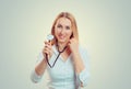 A female woman doctor with a stethoscope listening looking at you Royalty Free Stock Photo