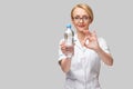 female woman nutritionist or dietician doctor healthy lifestyle concept - holding bottle of water