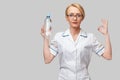 female woman nutritionist or dietician doctor healthy lifestyle concept - holding bottle of water