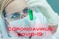 Female Woman Research Scientist With Test Tube In Coronavirus COVID-19 Laboratory Royalty Free Stock Photo