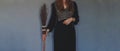 Female woman wiccan witch holding witch besom broom in hand