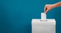 Female or women Voter Holds Envelope In her Hand Above Vote Ballot for casting vote on blue background