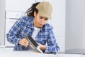 Female worker applying caulking silicone