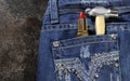 Female worker blue jeans with rhinestone decoration