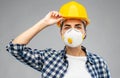 Female worker or builder in helmet and respirator Royalty Free Stock Photo