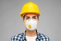 Female worker or builder in helmet and respirator Royalty Free Stock Photo