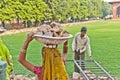 Female worker carries rock waste on her hat in Delhi, India. 2,057  Mio women work in the construction business 2004 and the Royalty Free Stock Photo