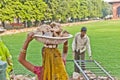 Female worker carries rock waste on her hat Royalty Free Stock Photo