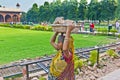 Female worker carries rock waste on her hat Royalty Free Stock Photo