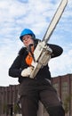 Female worker with chainsaw