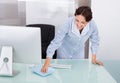 Female worker cleaning office