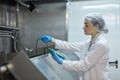 Female Worker Controlling Temperature at food Factory Royalty Free Stock Photo