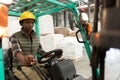 Female worker driving forklift in warehouse Royalty Free Stock Photo