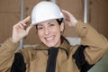 Female worker with hard hat smiling Royalty Free Stock Photo