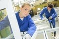 Female worker holds glass Royalty Free Stock Photo