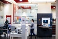 Female worker inside Societe Generale bank branch