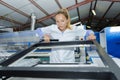 female worker inspecting window frames at factory Royalty Free Stock Photo