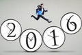 Female worker jumps above the clock