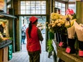 Female worker makes bouquet at Public Market, Seattle