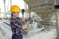 Female worker mixing ingredients in concrete mixer Royalty Free Stock Photo