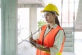 Female worker occupation. Woman inspector / architect checking interior material process in house reconstruction project Royalty Free Stock Photo