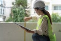 Female worker. Woman inspector / architect checking interior material process in house reconstruction project Royalty Free Stock Photo