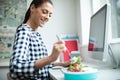 Female Worker In Office Having Healthy Chicken Salad Lunch At Desk Royalty Free Stock Photo