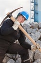 Female worker with pickaxe Royalty Free Stock Photo