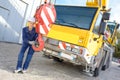 Female worker posing in front truck Royalty Free Stock Photo