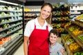 Female worker posing with little boy Royalty Free Stock Photo