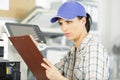 female worker reading clipboard Royalty Free Stock Photo